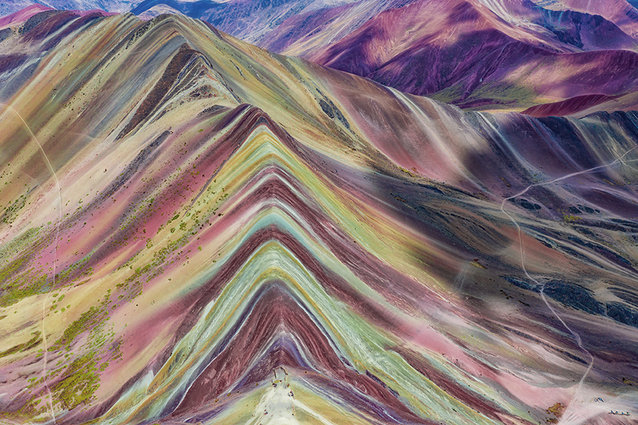 Aerial view of the Rainbow Mountains (Montana de Siete Colores) in Peru with Vinicunca in the center.