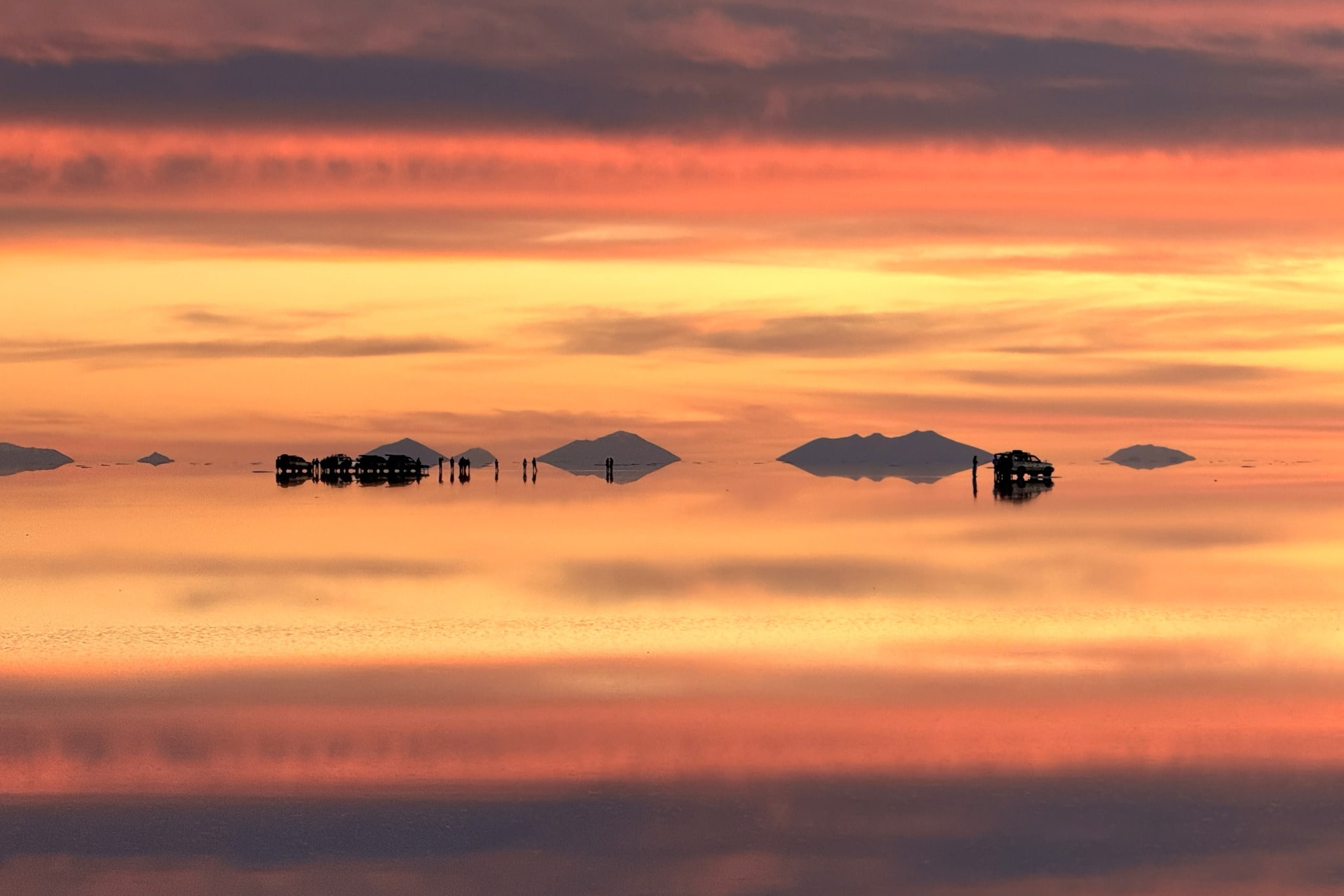 Flamingos flying across the Salar de Uyuni photo 1